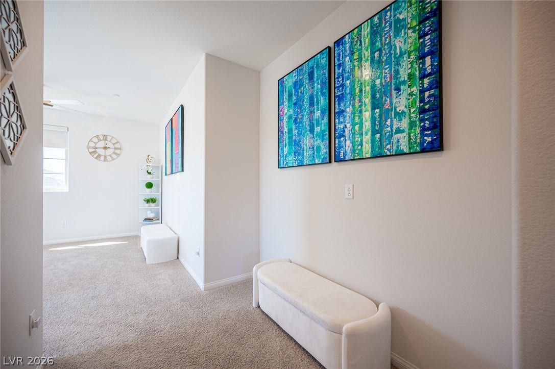 320 Della Pergola Place, Henderson, NV 89015 An inviting hallway featuring soft carpeting and clean architectural lines leads into the main living areas.