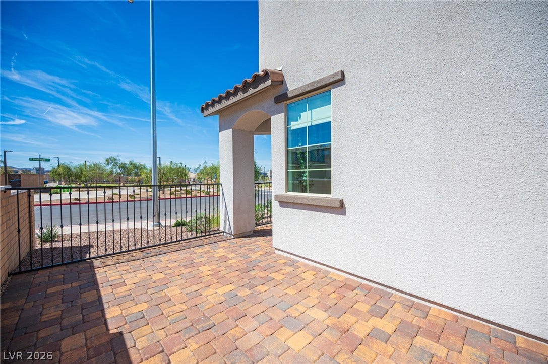 320 Della Pergola Place, Henderson, NV 89015 An inviting paver patio sits outside the stucco exterior of this modern home.