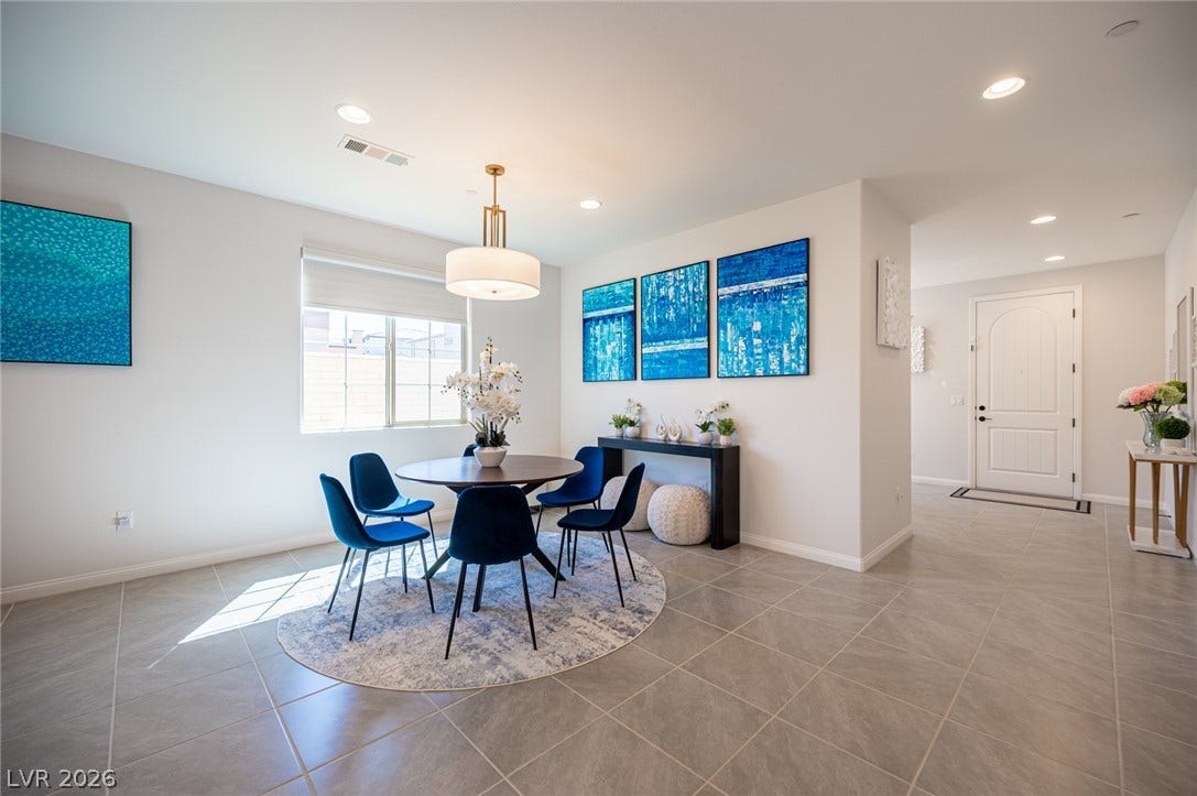 320 Della Pergola Place, Henderson, NV 89015 Gleaming tile floors and recessed lighting enhance this open-concept dining space.