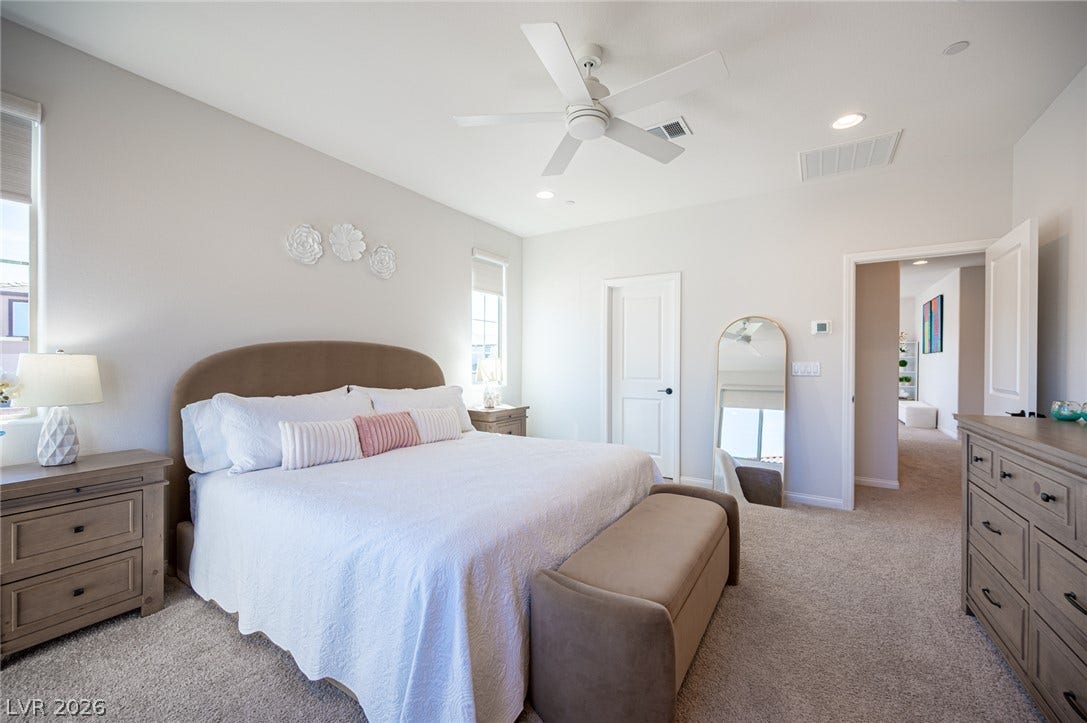 320 Della Pergola Place, Henderson, NV 89015 Soft carpeting pairs with neutral walls in this comfortable secondary bedroom.