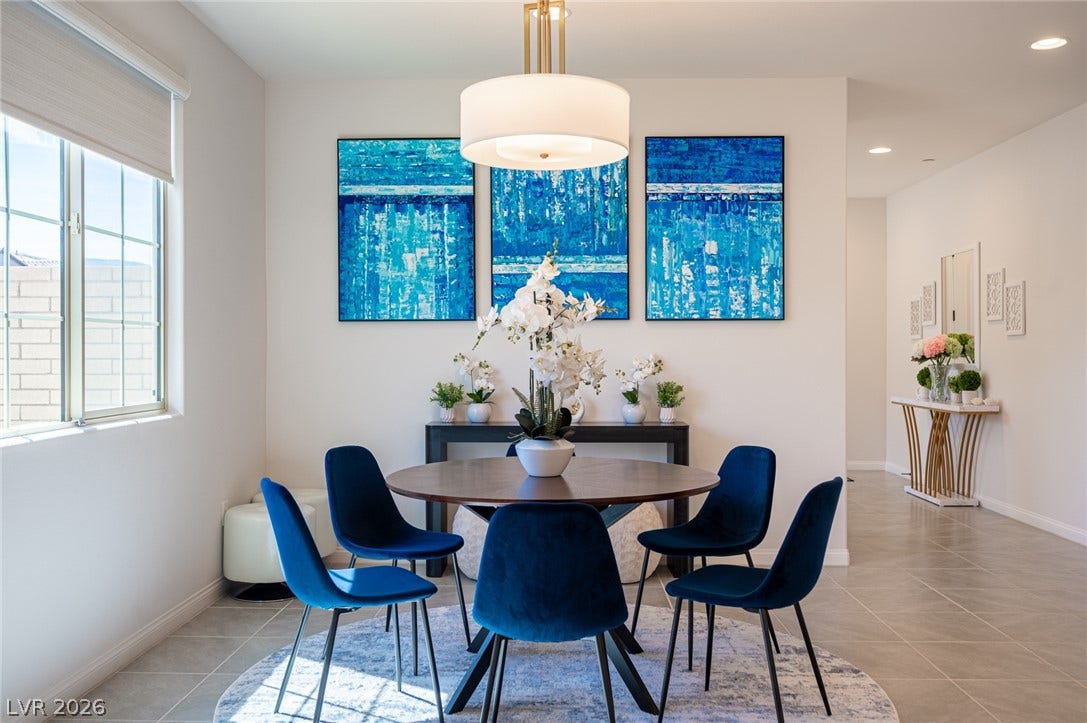 320 Della Pergola Place, Henderson, NV 89015 Elegant tile flooring and recessed lighting define this inviting dining space.