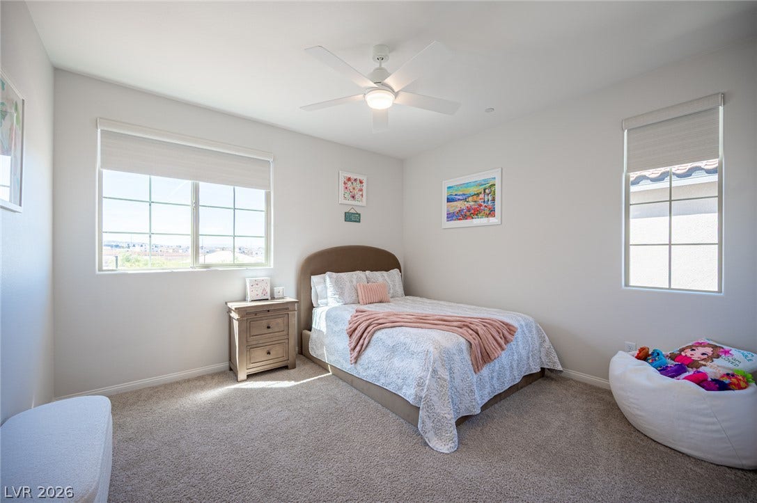 320 Della Pergola Place, Henderson, NV 89015 Multi-pane windows draw natural light onto plush carpeting.