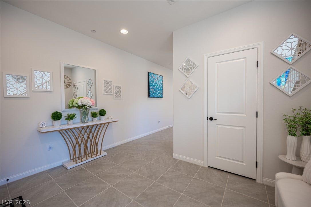 320 Della Pergola Place, Henderson, NV 89015 An inviting entrance foyer showcases large-format tile flooring and recessed lighting.