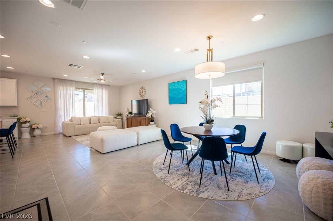320 Della Pergola Place, Henderson, NV 89015 Gleaming tile floors and recessed lighting enhance this airy, open-concept living space.