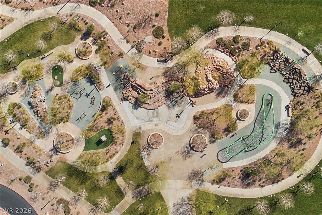 320 Della Pergola Place, Henderson, NV 89015 A top-down aerial perspective reveals winding concrete pathways and beautifully integrated desert landscaping.