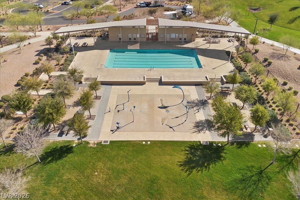 320 Della Pergola Place, Henderson, NV 89015 An aerial perspective showcases a community swimming pool alongside an adjacent splash pad.