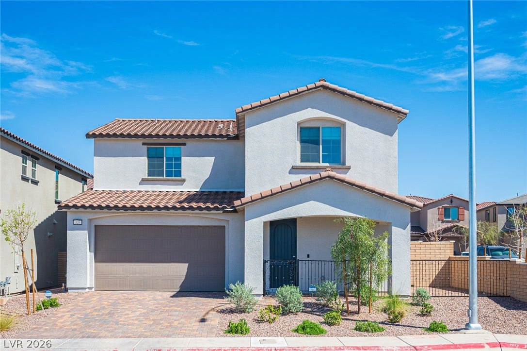 320 Della Pergola Place, Henderson, NV 89015 Spanish tile roofing and a paved driveway enhance the exterior of this two-story residence.