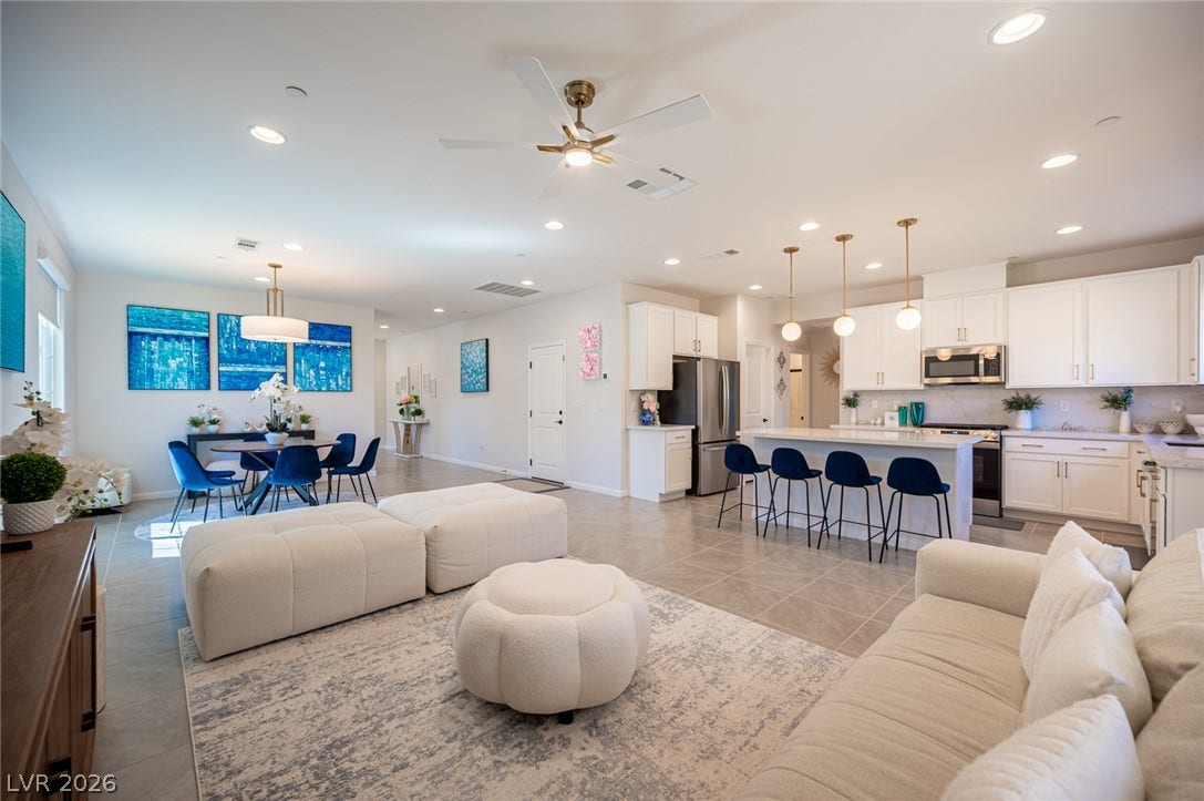320 Della Pergola Place, Henderson, NV 89015 Clean tile floors anchor this generous, fluid layout connecting the living and dining areas.