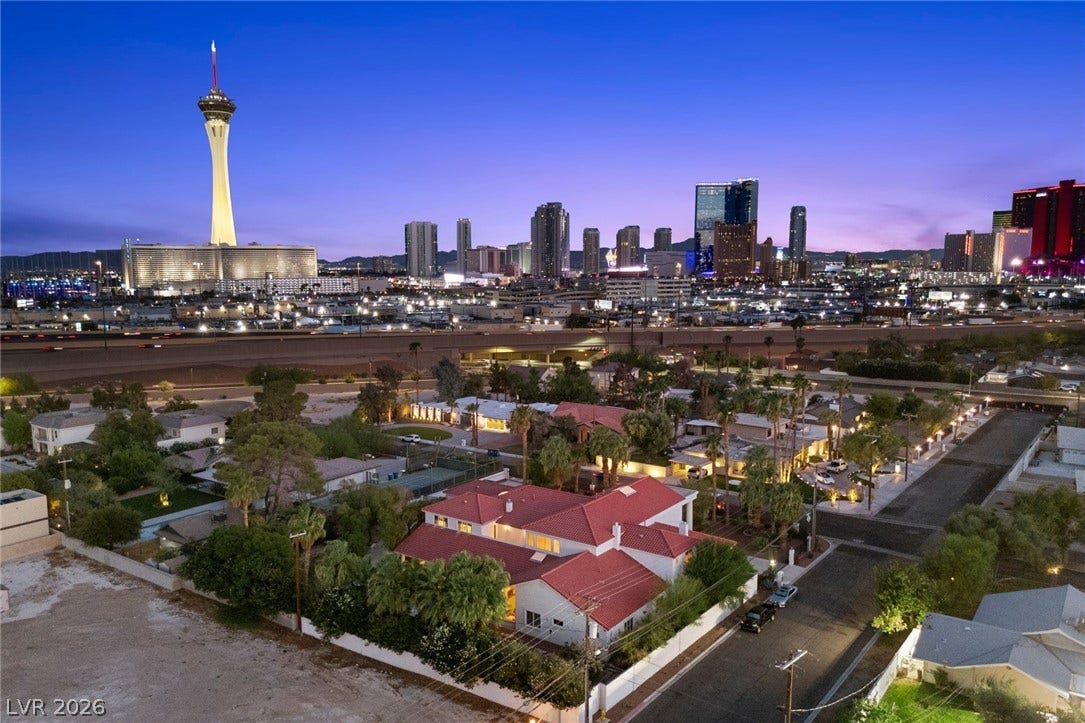 Panoramic city lights and a iconic skyline backdrop frame this remarkable neighborhood setting.