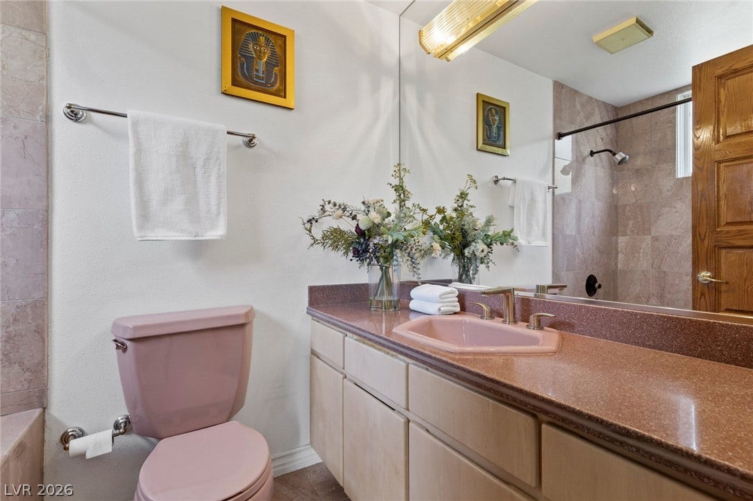 All bedrooms are ensuite with tiled walls and a spacious vanity with integrated storage define this functional bathroom space.