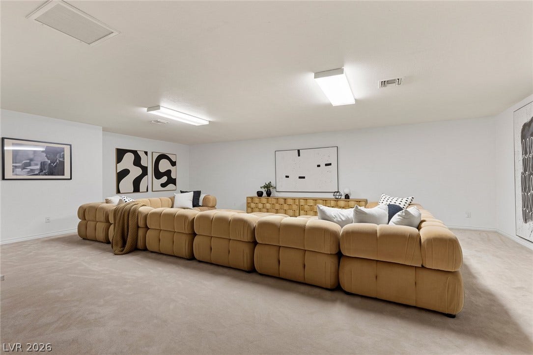 Plush wall-to-wall carpeting spans this versatile upstairs den.