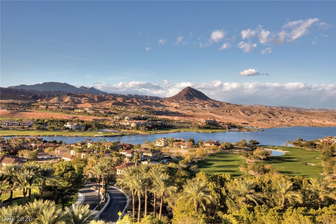 Dramatic mountain and water vistas frame this elevated view of the surrounding landscape.