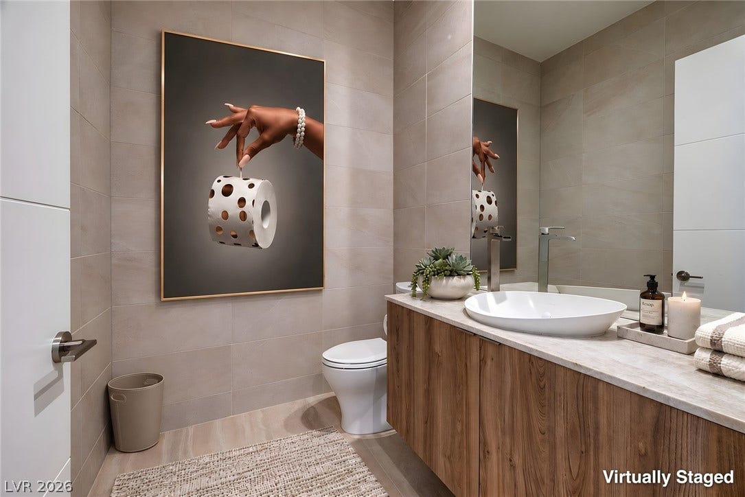 A floating vanity and large format wall tile create a sleek contemporary powder room.