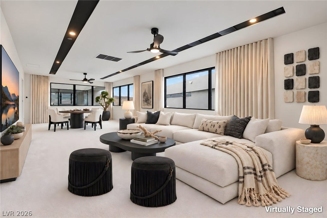 Clean lines and expansive windows define this light-filled modern living area.