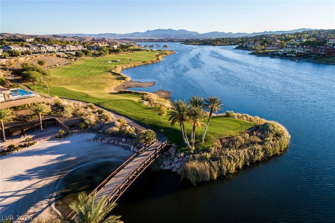 Panoramas of the sparkling lake and championship golf course frame this exceptional desert oasis.
