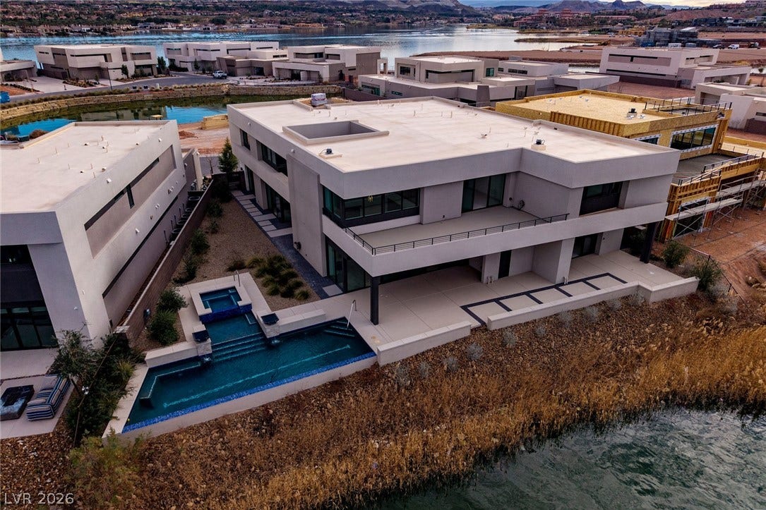Sleek contemporary architecture highlights this premier waterfront estate featuring a private pool and spa.