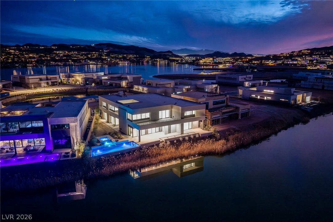 Dramatic lakeside views frame this modern architectural estate complete with a private pool.