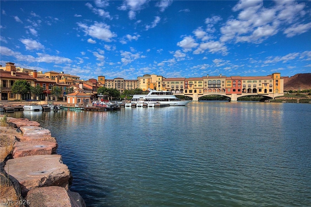 Scenic waterfront vistas overlook the tranquil lake and harbor from this Mediterranean-style resort community.