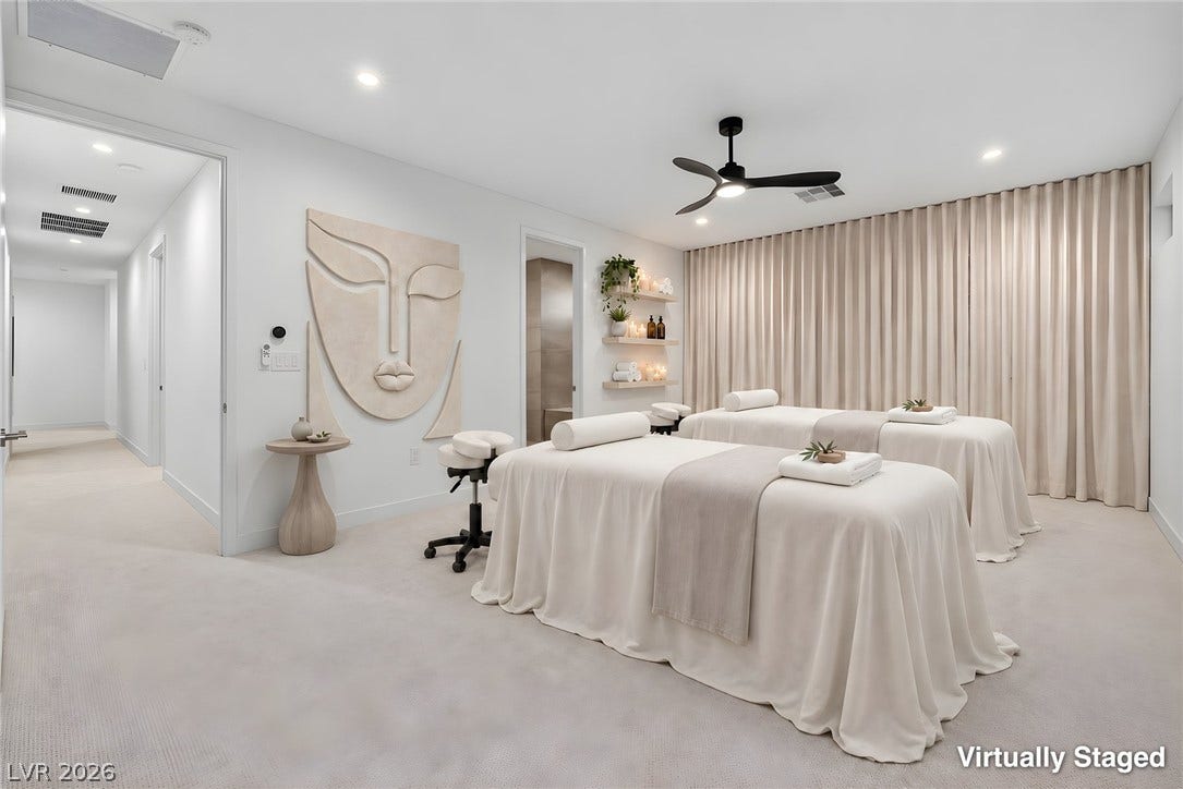Recessed lighting and soft carpeting create a serene and relaxing ambiance throughout the room.