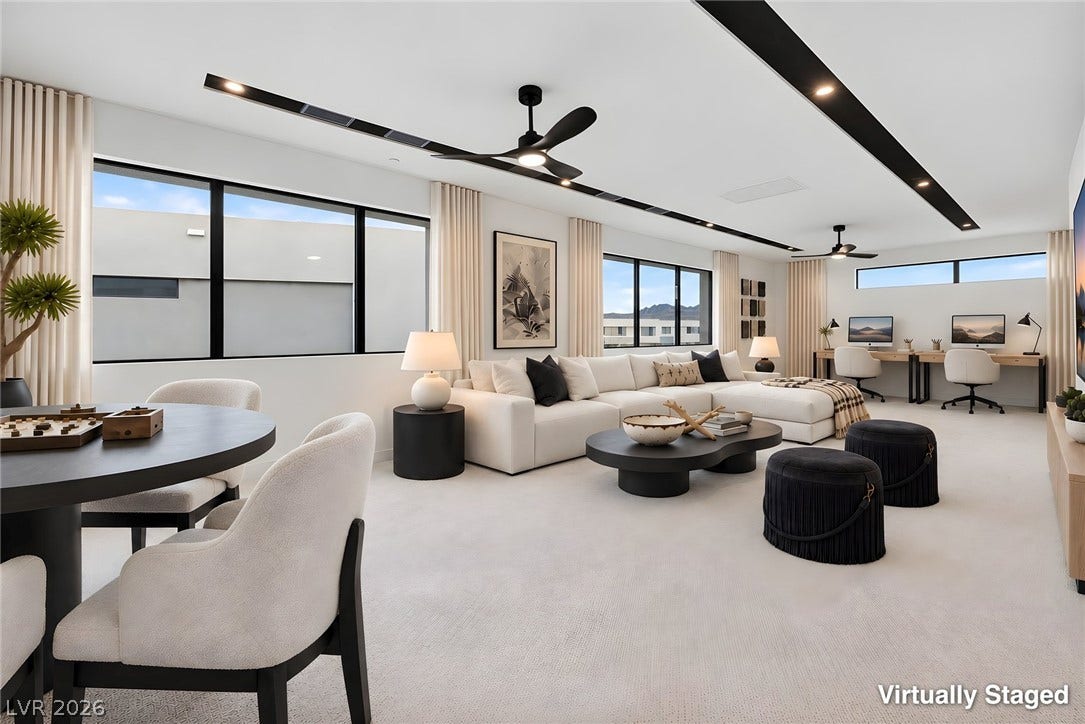 Clean lines and vast windows define this expansive multi-functional living and dining area.