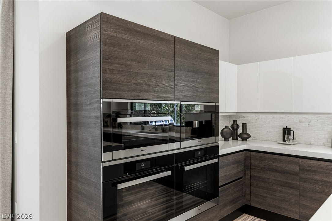 Miele Double Built-In Ovens, Microwave, and Built-In Coffee Maker.