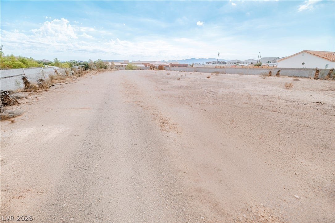 Redwood Street, Las Vegas, NV 89139 A spacious desert parcel offers potential for custom development within a walled boundary.