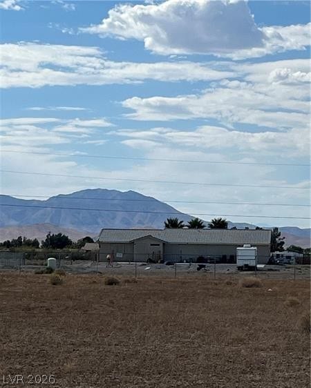 801 S Ford Loop, Pahrump, NV 89048 A spacious lot frames views of distant mountain ranges under a wide sky.