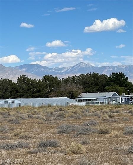 801 S Ford Loop, Pahrump, NV 89048 Dramatic mountain peaks rise in the distance beyond the property line.