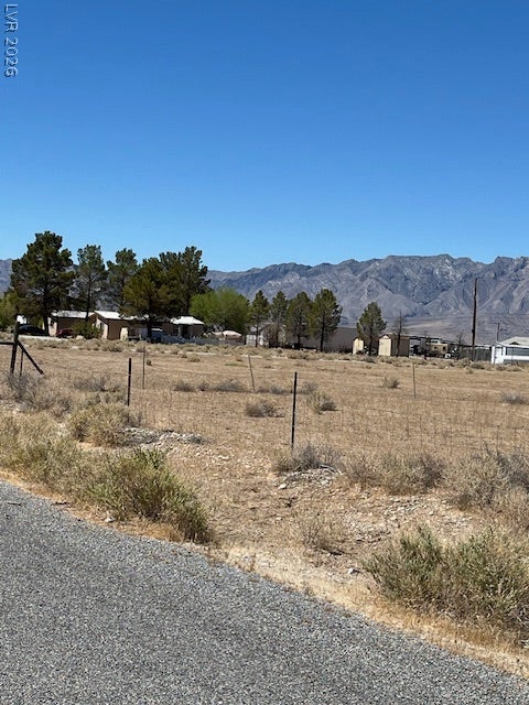 801 S Ford Loop, Pahrump, NV 89048 Dramatic mountain peaks rise in the distance beyond this open, level lot.