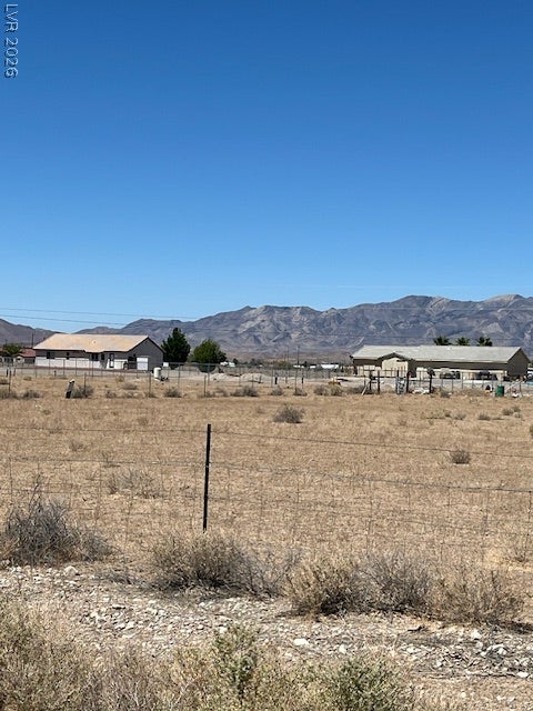 801 S Ford Loop, Pahrump, NV 89048 Dramatic mountain peaks rise in the distance beyond the vast open landscape.
