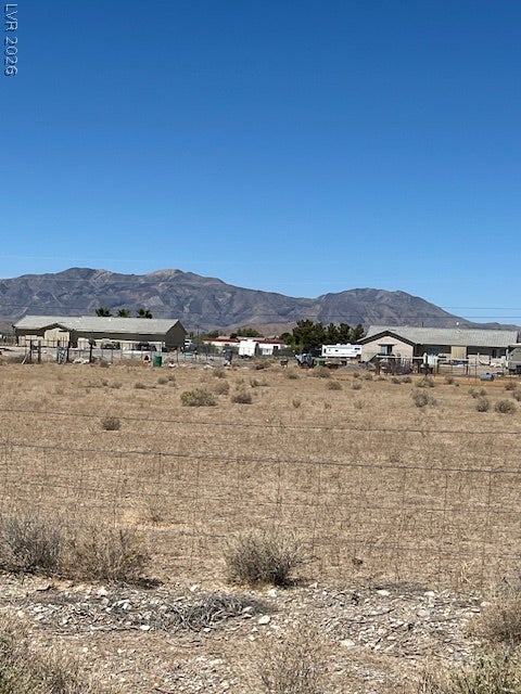 801 S Ford Loop, Pahrump, NV 89048 Dramatic mountain vistas rise behind the open terrain of this property.