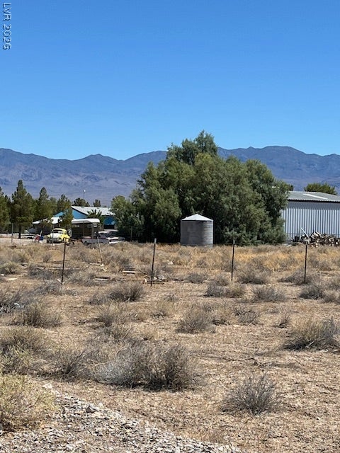 801 S Ford Loop, Pahrump, NV 89048 Dramatic mountain vistas frame the rugged desert landscape surrounding this expansive property.
