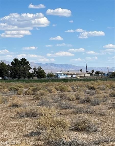 801 S Ford Loop, Pahrump, NV 89048 Distant mountains frame this open landscape under a wide blue sky.