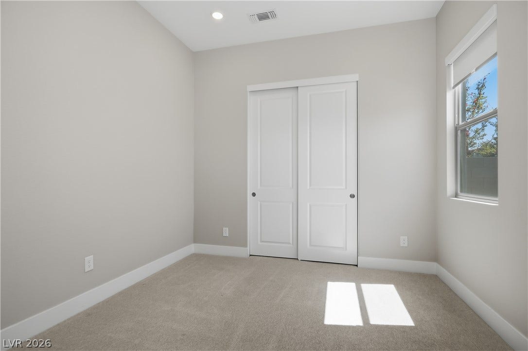 11164 Twisty Ridge Street, Las Vegas, NV 89183 Recessed lighting, smooth walls, and plush carpeting define this versatile space.