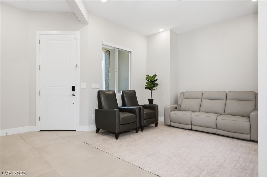 11164 Twisty Ridge Street, Las Vegas, NV 89183 Clean lines and neutral tile flooring define this welcoming entryway and living space.