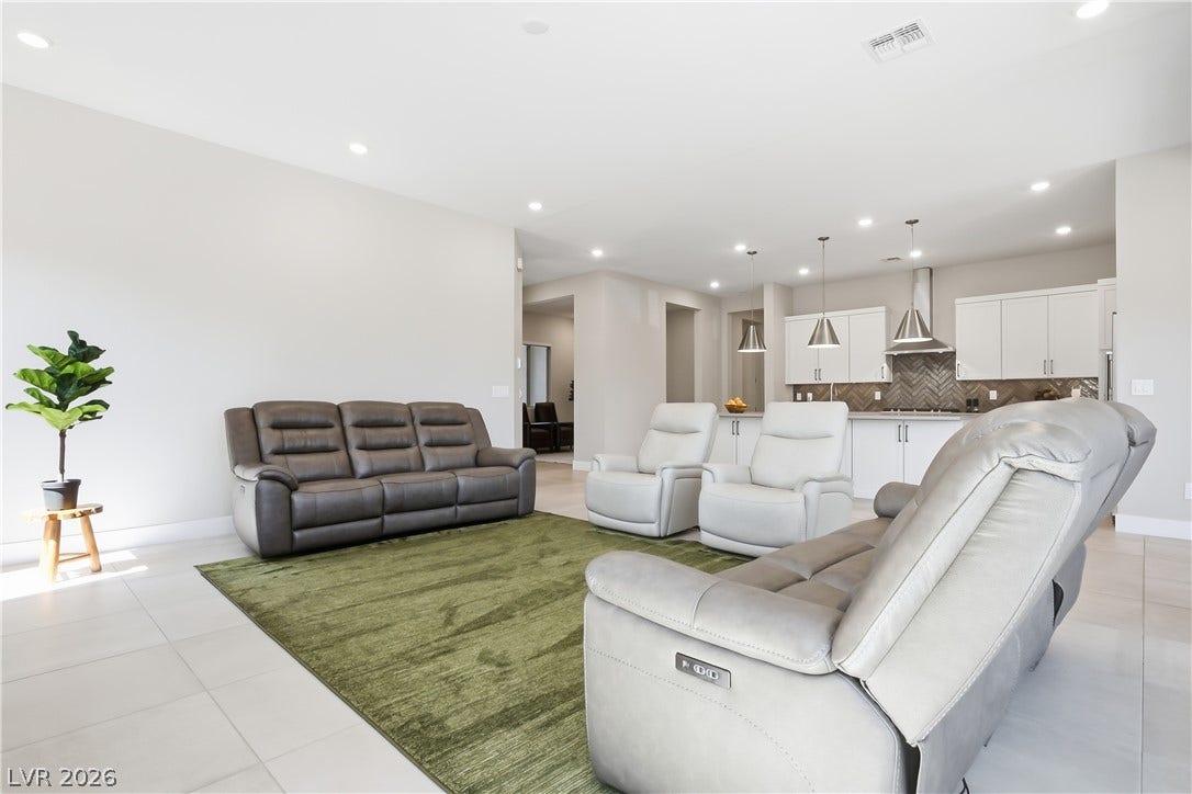11164 Twisty Ridge Street, Las Vegas, NV 89183 An airy open layout seamlessly connects the generous living area to a modern kitchen.