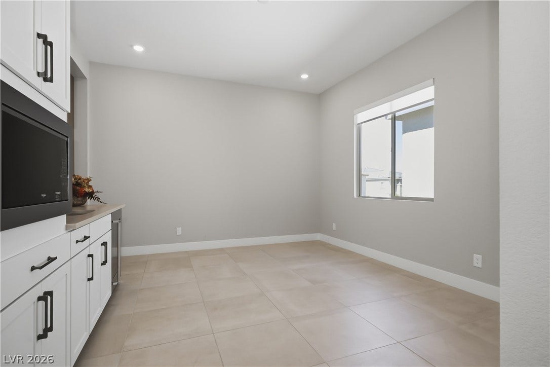 11164 Twisty Ridge Street, Las Vegas, NV 89183 Tiled floors and recessed lighting enhance this versatile space situated off the kitchen area.