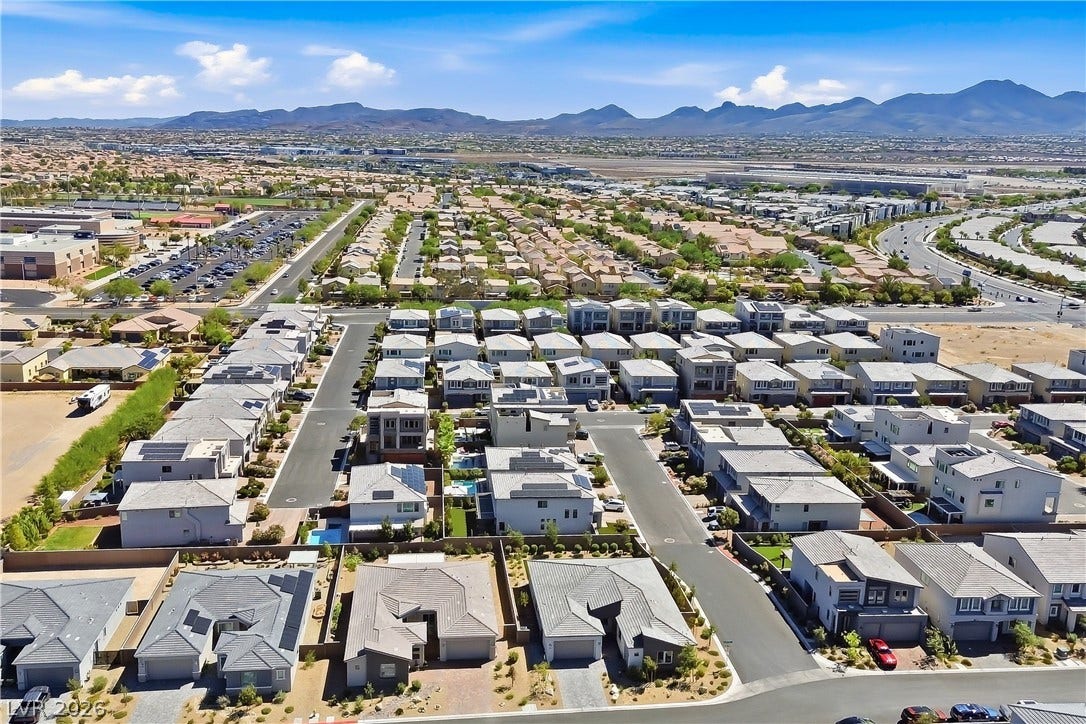 11164 Twisty Ridge Street, Las Vegas, NV 89183 Panoramic neighborhood views unfold toward distant mountains under a blue desert sky.