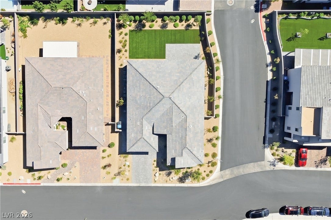 11164 Twisty Ridge Street, Las Vegas, NV 89183 An aerial perspective showcases the structured tile roof and neat surrounding landscape design.