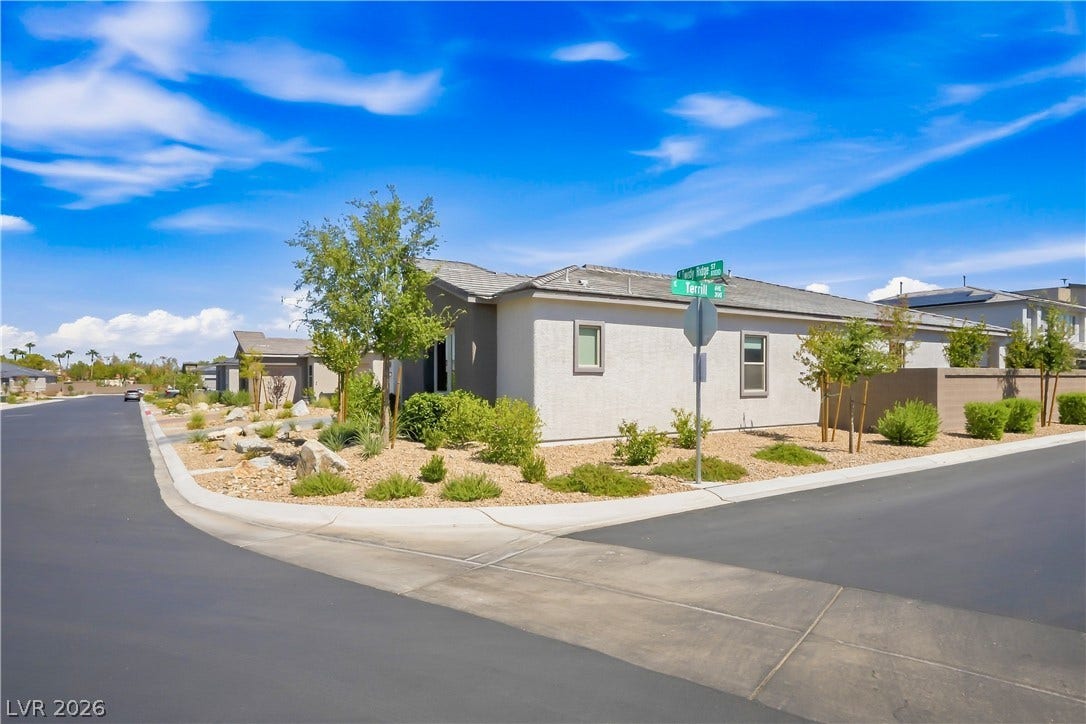 11164 Twisty Ridge Street, Las Vegas, NV 89183 Neat desert landscaping and clean modern lines define this welcoming corner lot property.