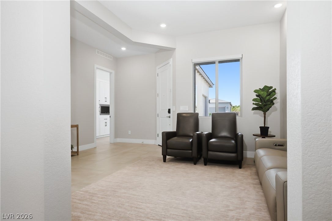 11164 Twisty Ridge Street, Las Vegas, NV 89183 Recessed lighting illuminates this versatile living space featuring clean architectural lines and tile flooring.