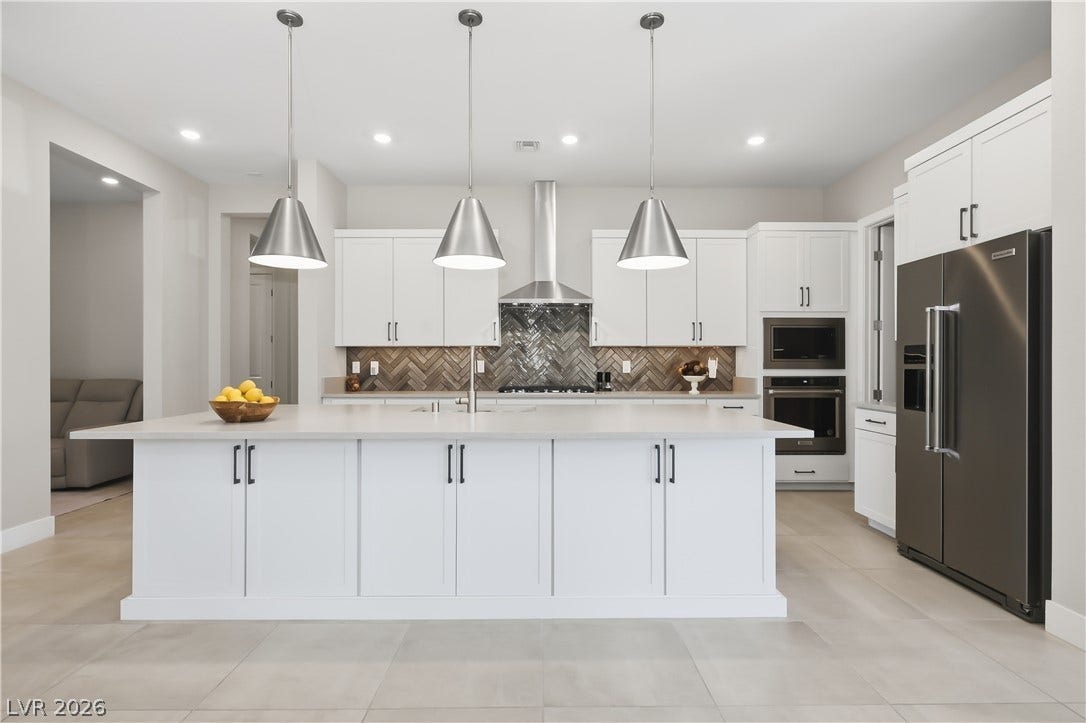 11164 Twisty Ridge Street, Las Vegas, NV 89183 Clean lines and a spacious center island define this modern culinary space.