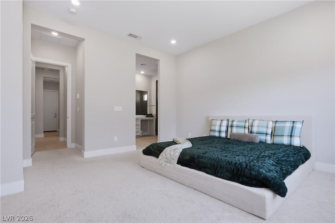 11164 Twisty Ridge Street, Las Vegas, NV 89183 Plush wall-to-wall carpeting and recessed lighting define this spacious bedroom suite.