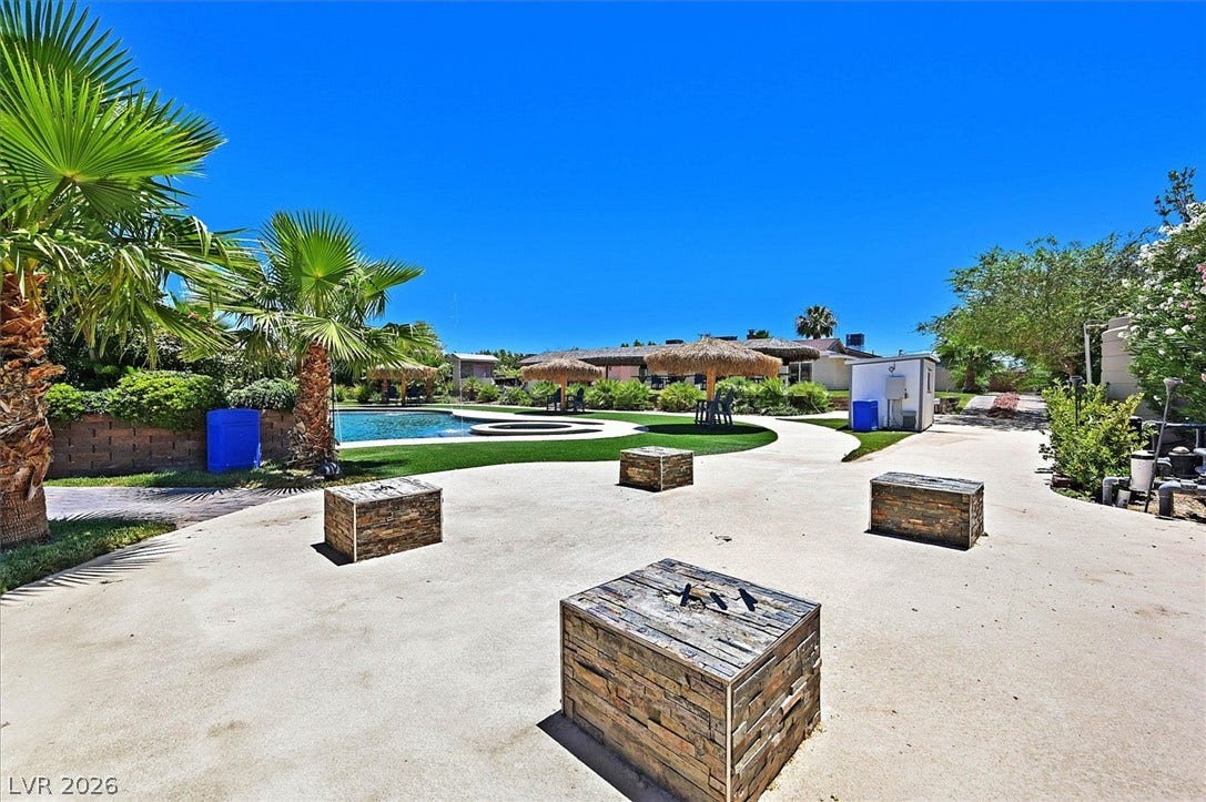 A tranquil oasis awaits, complete with a resort-style pool and lush tropical landscaping.