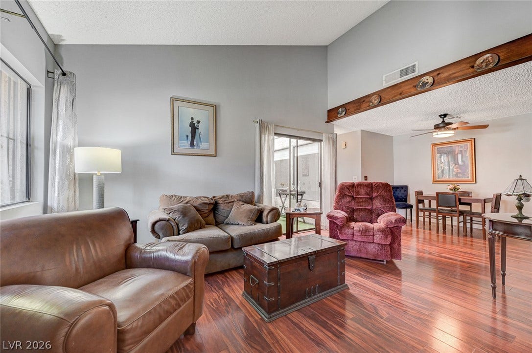 High vaulted ceilings and gleaming hardwood floors create a welcoming, open living space.