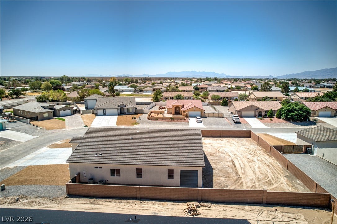 Aerial view of residential area with a mountain backdrop