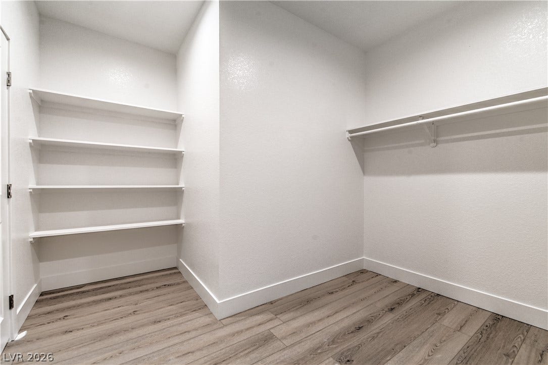 Walk in closet featuring light wood-type flooring