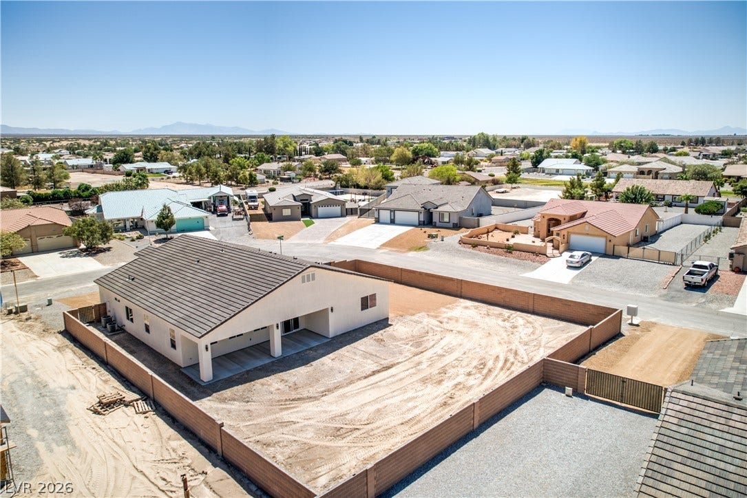Aerial perspective of suburban area with a mountain backdrop