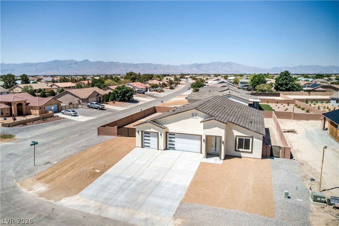 Aerial perspective of suburban area featuring mountains