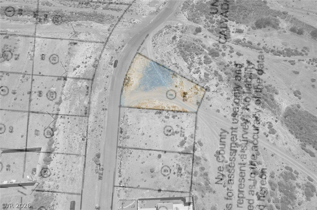 1060 S Firebird Circle, Pahrump, NV 89048 A property plat map outlines the boundaries of this vacant desert lot.